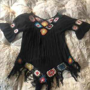 Black fashion top with colorful woven accents